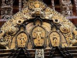 Kathmandu Changu Narayan 18 Lakshmi, Vishnu And Garuda On The Torana Above Main Entrance To Changu Narayan Temple Vishnu is engraved in the brass work of the torana above the main west door of the Changu Narayan Temple in the Kathmandu Valley. To the left is Lakshmi (Laxmi) and to the right is Garuda.